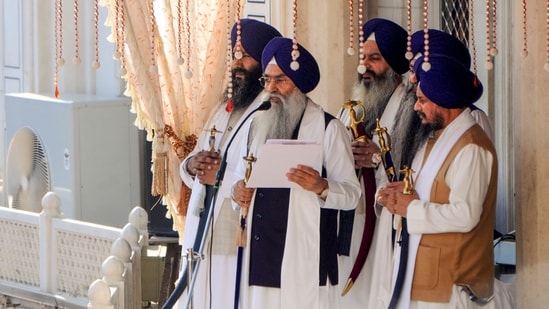 Amritsar: Akal Takht Jathedar Giani Raghbir Singh with five high priests during the hearing of 'tankhaiya' (guilty of religious misconduct) case by the Akal Takht, at the Golden Temple in Amritsar, Monday, Dec. 2, 2024.(PTI)