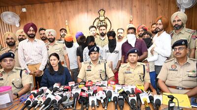 Deputy inspector general (DIG), Patiala range, Kuldeep Chahal (centre) addressing the press conference in Barnala on Tuesday. (HT Photo) Deputy inspector general (DIG), Patiala range, Kuldeep Chahal (centre) addressing the press conference in Barnala on Tuesday. (HT Photo)