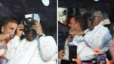 Mallikarjun Kharge who was sitting next to Lok Sabha leader of opposition Rahul Gandhi. Anti-CEC protest: Congress chief Kharge dons Batman mask during march to Supreme Court