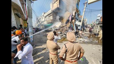 An agitated mob torched a chemist shop which was demolished by Mansa district authorities on Wednesday. The shop belonged to Ashwani Kumar, where he fatally shot Parvinder Singh Jhota on Tuesday morning. (HT Photo) An agitated mob torched a chemist shop which was demolished by Mansa district authorities on Wednesday. The shop belonged to Ashwani Kumar, where he fatally shot Parvinder Singh Jhota on Tuesday morning. (HT Photo)