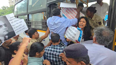 (Credit: Syed Asif/TOI) The journalists were attempting to document police personnel pushing and pulling women protesters. The photojournalist said there were few women police personnel present as male officers handled the protesters. Cops detain anti-SIR protesters, assault journalists in Bengaluru