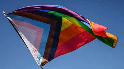 File photo: - A pride flag is held during an LGBTQ+ Pride March In SC, biological women oppose equal rights for transgender women