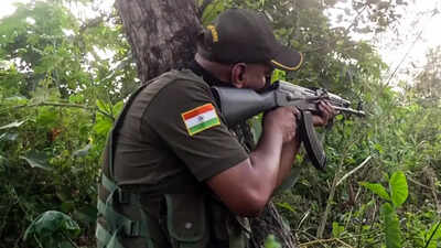 A sniper of Special Operations Group (SOG) of the Jammu and Kashmir Police in action during a search operation Police recover arms, ammunition from north Kashmir forests