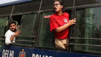 CJP protests: Neha Bora, National President of the All India Students' Association (AISA), shouts from a police vehicle after being detained ‘We cannot let this become normal’: AISA's Neha Bora on Delhi protest crackdown